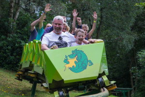 Man and child on rollercoaster